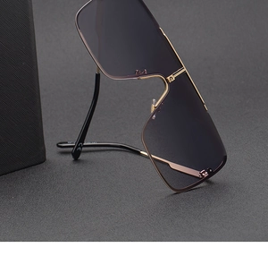 Detail of oversized rimless sunglasses with gold metal temples and CE safety mark