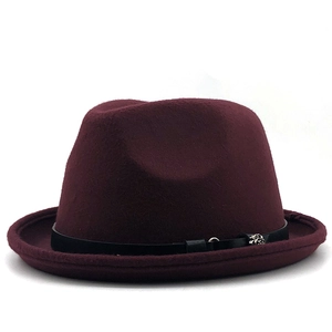 Detailed view of burgundy felt fedora with black leather band and silver rose buckle