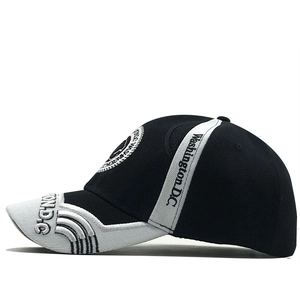 Detail of Washington D.C. embroidery on a black and white cotton baseball cap