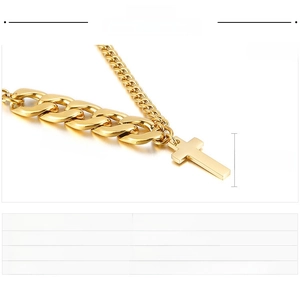 Detail view of gold titanium cross pendant with chunky curb chain and size dimensions