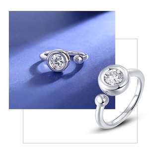 Macro detail of silver adjustable bubble ring featuring a round cut moissanite stone