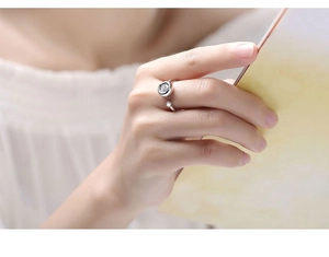 Close-up of S925 silver adjustable ring featuring a round solitaire moissanite stone