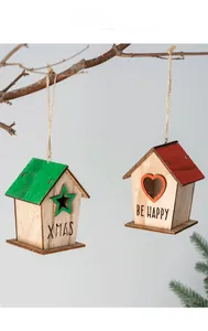 Detail view of rustic wooden Christmas houses with Xmas and Be Happy engravings on branches
