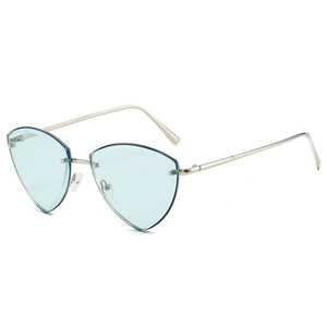 Lunettes de soleil œil-de-chat sans monture avec verres bleus et branches argentées