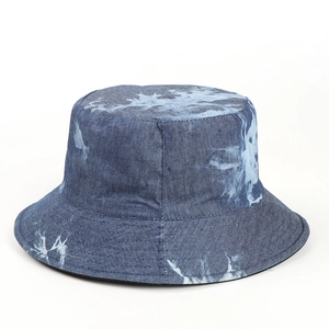 Close-up of blue and white tie-dye denim cotton bucket hat with textured fabric detail