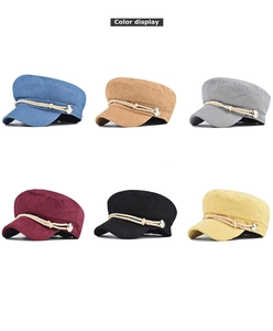 Color display of corduroy octagonal hats in six shades with woven rope and metal buttons