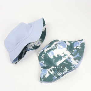 Flat lay of tie-dye bucket hats showing reversible design and reinforced stitching