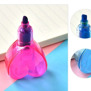 Detail of heart-shaped pastel highlighters showing the pink body and purple chisel tip