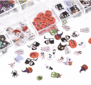 Macro shot of Halloween nail art wood pulp flakes with pumpkins and ghosts in 12-grid box