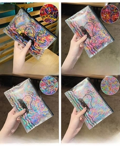 Detail of colorful disposable elastic hair bands in clear zip bags with octopus pattern
