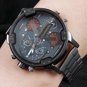 Macro view of multi-dial oversized black stainless steel watch showing quartz movement details