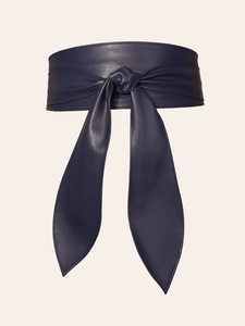 Detailed close-up of navy blue wide waist belt featuring a leather-like texture and bow knot