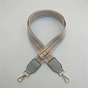 Adjustable woven purse strap with chevron embroidery and gold metal swivel hooks