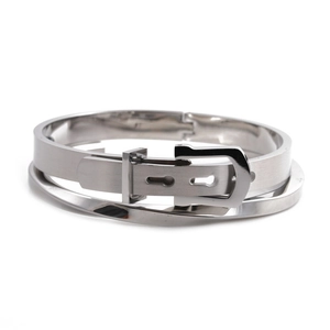Polished silver stainless steel bangle featuring a twisted double-layer belt buckle design