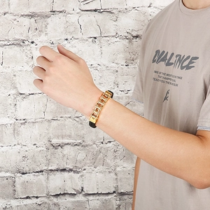 Men's mechanical style bracelet with gold stainless steel chain and black leather strap