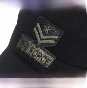 Close-up of black cotton cadet cap featuring AIR FORCE embroidery and military star insignia