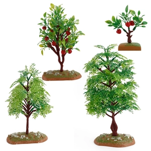 Set of four realistic miniature fruit trees and green plants with realistic soil bases