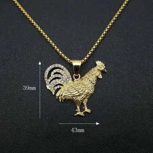 Gold plated hip hop rooster pendant with zircons, size 39mm by 43mm on dark background