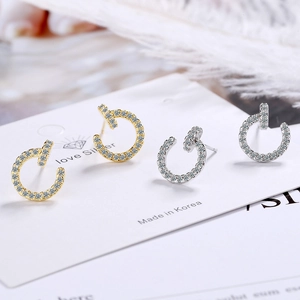 Minimalist C-shaped stud earrings with micro-pave cubic zirconia in gold and silver plating