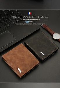 Close-up of men's bifold wallets showing matte leather texture and stitched edge details
