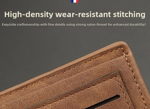 Macro detail of high-density stitching and lychee grain texture on a brown leather wallet