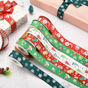 Close-up of assorted Christmas grosgrain ribbons with snowflakes and snowman patterns