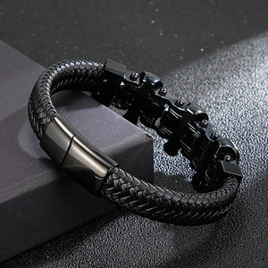 Men's black braided leather bracelet with skull metal charm and magnetic clasp