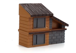 Detailed macro view of a miniature two-story brown wood and grey stone house model