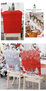 Detailed view of red and grey Christmas chair covers with gnome and snowflake prints