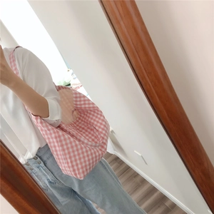 Pink gingham cotton tote bag shown on shoulder for daily school and shopping use
