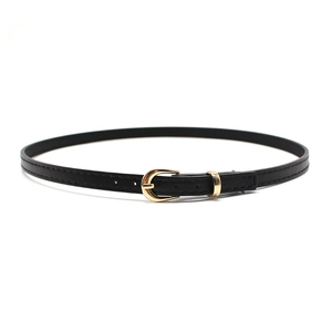 Detail of black faux leather belt with neat stitching and gold metal buckle