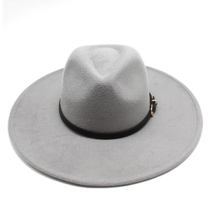 Detail of grey wool fedora hat featuring a black leather band and gold metal buckle
