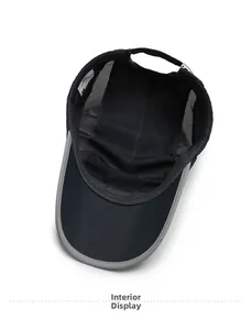 Interior detail of black quick-dry mesh cap showing breathable fabric and grey trimming
