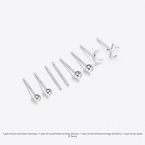 Detail view of S925 sterling silver set featuring star, moon and round stud earrings