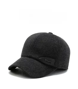 Detail of wool-like texture and leather sports tag on a grey winter baseball cap