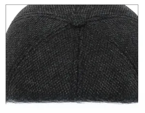 Detailed view of the reinforced stitching process on the crown of a men winter baseball cap
