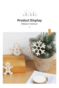 Close-up of laser-cut wooden Christmas ornaments with snowflake and snowman shapes