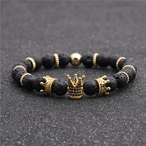Lava stone bead bracelet featuring a gold crown charm with micro black zircon inlays