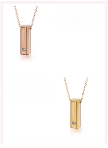 Detailed view of geometric 316L stainless steel pendants in rose gold and gold finish