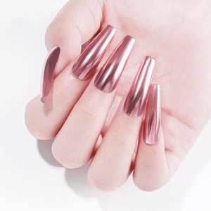 Detail of long coffin nails with rose gold mirror finish and metallic chrome effect
