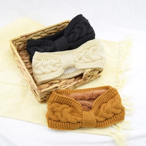 Detail of cable knit headbands with soft fleece lining in black, beige and yellow