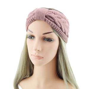 Pink chunky cable knit headband for women featuring a twisted bow knot winter warmer ear cover