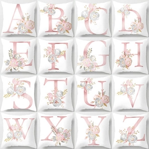 Macro display of assorted floral alphabet patterns on soft Christmas throw pillow covers