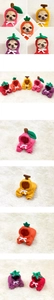 Detail of fruit themed pet hoodies featuring 3D hood decorations and soft knit fabric