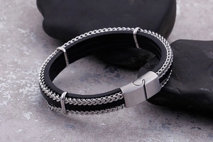 Close-up of black leather woven multi-layer bracelet with stainless steel magnetic clasp