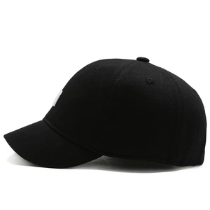 Classic black short brim baseball cap in cotton canvas with a 45-degree profile view