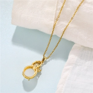 18K gold plated necklace featuring a white gourd pendant on soft white fabric