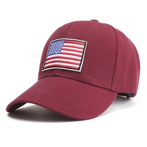 Detail of burgundy baseball cap featuring high-quality American flag embroidery patch