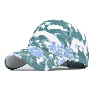 Detailed view of the blue and white tie-dye pattern on the cotton canvas baseball cap