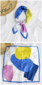 Detail of silk scarf with abstract face print showing both knot style and flat layout